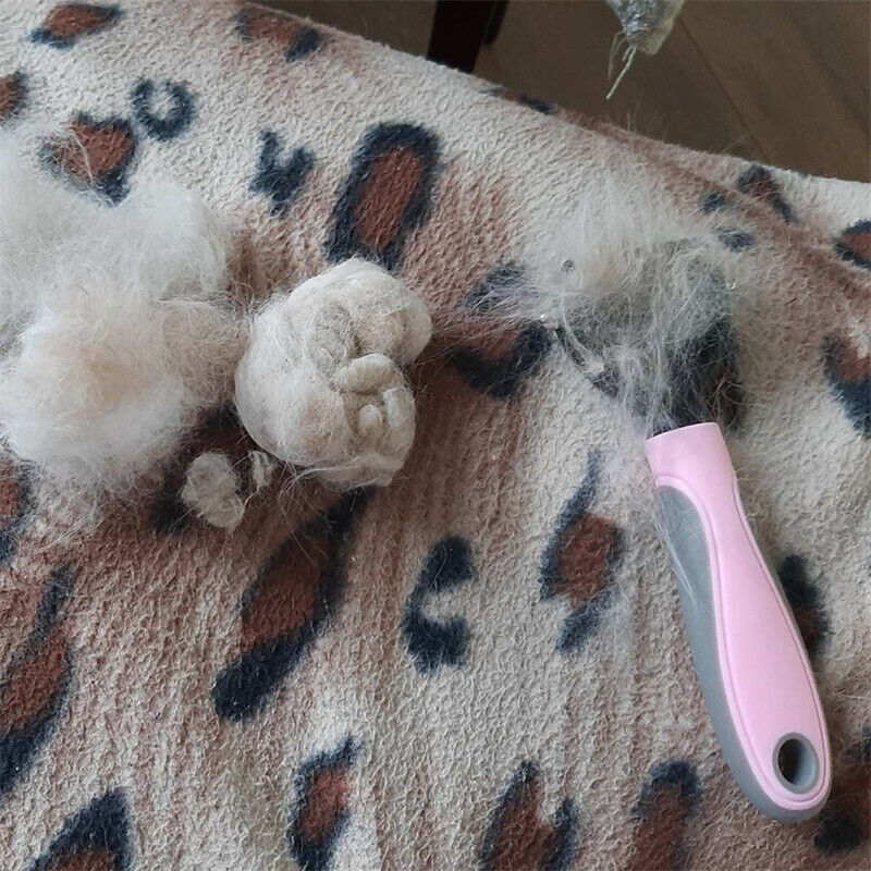 The double sided grooming brush for dogs and cats with deshedding  and dematting tools for loose fur removing